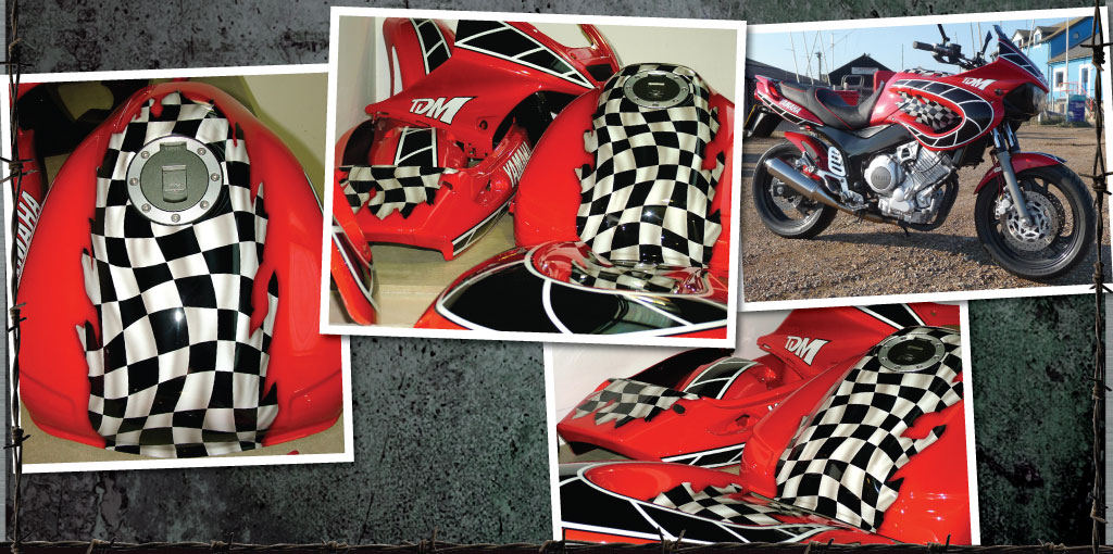Yamaha TDM in red with wavey checkered flag
